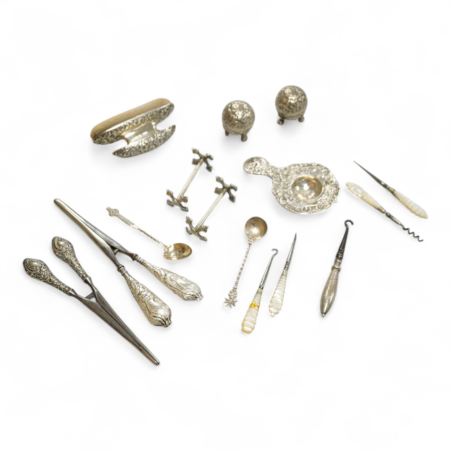 Sundry small silver and white metal items including a pair of Indian condiments, a nail buffer, two pairs of glove stretchers, a tea strainer, two spoons, a pair of plated knife rests, etc.